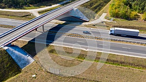 View from above on riding truck on highway under bridge