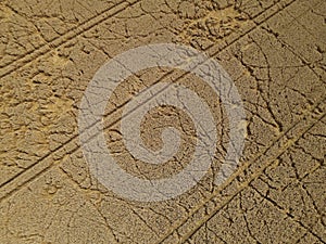 View from above of ripe but damaged crop field in the countryside