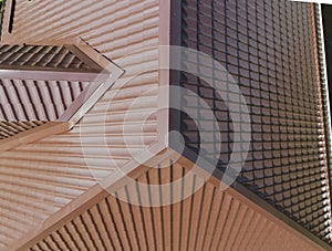 A view from above on the roof of the house. The roof of corrugated sheet. Roofing of metal profile wavy shape