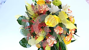 View from above, rotation on white background, floral composition consists of Rose penny lane, Carnation, Cymbidium