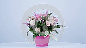 View from above, rotation on white background, floral composition consists of Rose penny lane, Carnation, Cymbidium