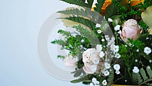 View from above, rotation on white background, floral composition consists of Rose penny lane, Carnation, Cymbidium