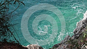 View from above sea coast how waves crash against rocks in Montenegro seaside of Adriatic sea