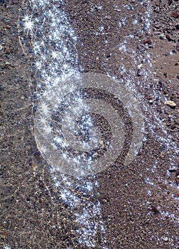 View from above to a stony seabed, crystal clear water