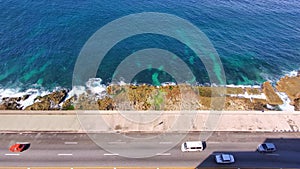 A view from above at traffic on EL Malecon, Avenida de Maceo, a broad landmark esplanade that stretches for 8 km along