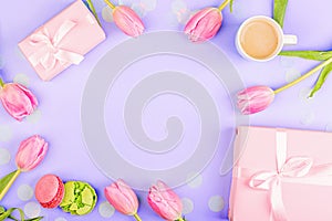 View from above tulips and gift box with copy space on violet background. Mockup for womens day, 8 March Valentine's day