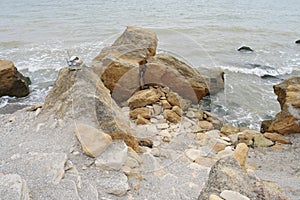 Man-made steps of stones and sand to the seashore