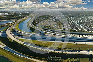 View from above of USA transportation infrastructure. Aerial view of american freeway intersection with fast driving