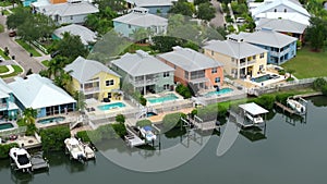 View from above of waterfront neighborhood in Florida with suburban houses. Development of US seaside premium housing