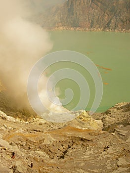 View on the acidic crater lake of the Ijen volcano in Indonesia, a sulfur mine and toxic gaz