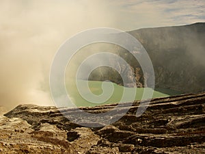 View on the acidic crater lake of the Ijen volcano in Indonesia, a sulfur mine and toxic gaz