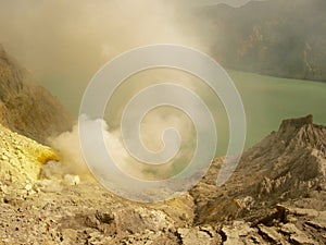 View on the acidic crater lake of the Ijen volcano in Indonesia, a sulfur mine and toxic gaz