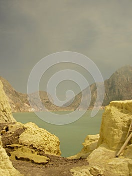 View on the acidic crater lake of the Ijen volcano in Indonesia, a sulfur mine and toxic gaz