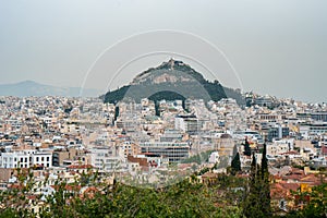 View from Acropolis on cityscape of Athens and Lycabettus Hill, known as Lykabettos