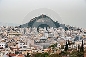 View from Acropolis on cityscape of Athens and Lycabettus Hill, known as Lykabettos