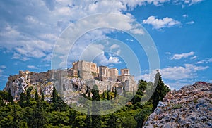 View of Acropolis hill from Areopagus hill on summer day with great clouds in blue sky, Athens, Greece. UNESCO heritage