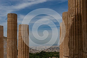View from the Acropolis to Athens through the columns of the Parthenon. Greece. Blue sky.