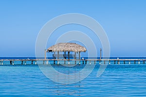 A view acros a jetty close to West Bay on Roatan Island photo