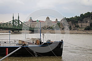A view across the Danube to Liberty Bridge, Gellert Spa and Cave in Budapest photo