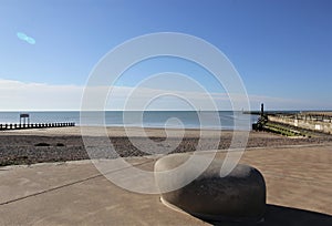 View across a deserted beach to the sea