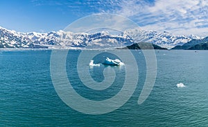 A view across Disenchartment Bay past icebergs towards the Valerie Glacier in Alaska