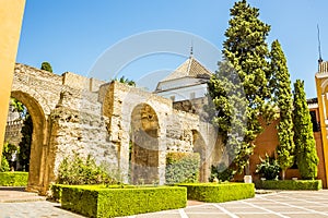 A view across the entrance courtyard of the Alcazar Palace in Seville, Spain