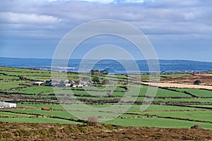 The view across fields from Chapel Carn Brea, Cornwall photo