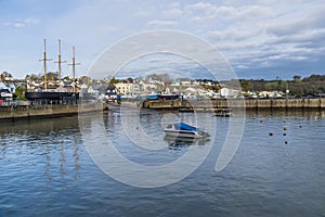 A view across the harbour towards the village at high tide in Saundersfoot, Wales