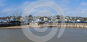 A view across the inner harbour at low tide in Saundersfoot, Wales