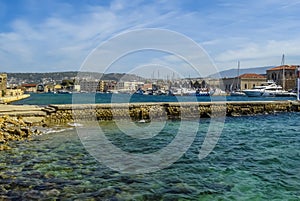 A view across an internal breakwater in Chania harbour, Crete on a bright sunny day