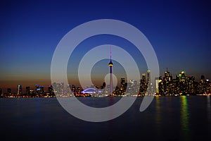 Downtown Toronto with iconic tower in sunset