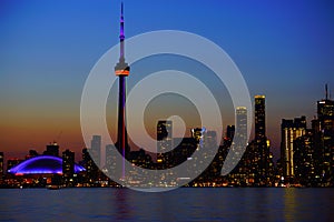 Downtown Toronto with iconic tower in sunset