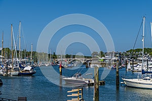 A view across moorings towards the railway bridge up the River Hamble