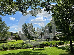 View across the River Aire, with cottages and a church in, Gargrave, Yorkshire, UK