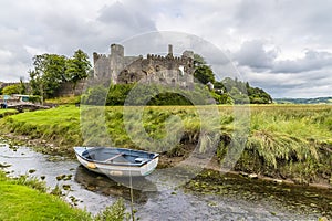 A view across the River Coran towards the castle at Laugharne, Pembrokeshire, South Wales