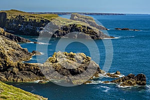 A view across the rocky coastline of Skomer Island breeding ground for Atlantic Puffins towards the mainland