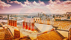View across the roof tops and chimneys of Ramsgate town, Kent, UK, towards the Royal Harbour and the English Channel