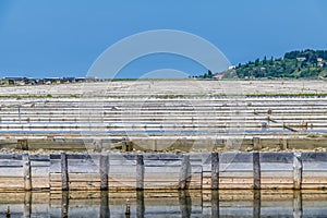 A view across the sides of crystallisation pools at the salt pans at Secovlje, near to Piran, Slovenia