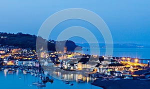 View across the Teign River and Teignmouth small seaside town with bright buildings in England