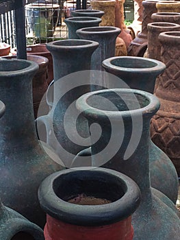 View across the tops of Mexican chimeneas at an outdoor market photo