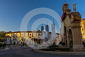 A view across the town gate towards the bullring stadium in Antequera, Spain photo