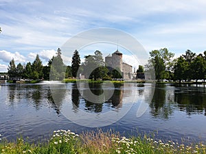 View across water towards the medieval Olavinlinna castle