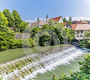 A view across the weir on the Selca Sora River in the town of Skofja Loka, Slovenia