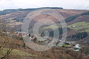 A VIEW ACROSS A WELSH VALLEY OVER A VILLAGE photo