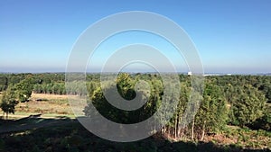 View across woodland and forest to the Bracknell Town Centre in Berkshire England. Pan from left to right.