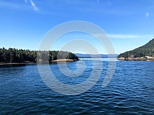 A view of active pass, a common BC Ferries route through the gulf islands, on a beautiful sunny summer day