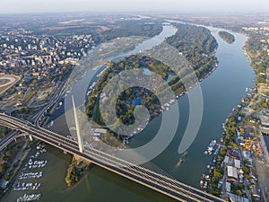 View of Ada Ciganlija from aerial drone and Most na Adi bridge over Sava River. Belgrade - Serbia