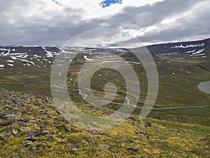 View on adalvik and latrar in west fjords nature reserve Hornstrandir in Iceland with lake and river stream photo