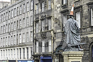 View of Adam Smith statue in Royal Mile street Edinburgh