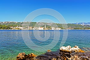 View of the Adriatic Sea and the island Rab, Croatia, with rocks in the foreground